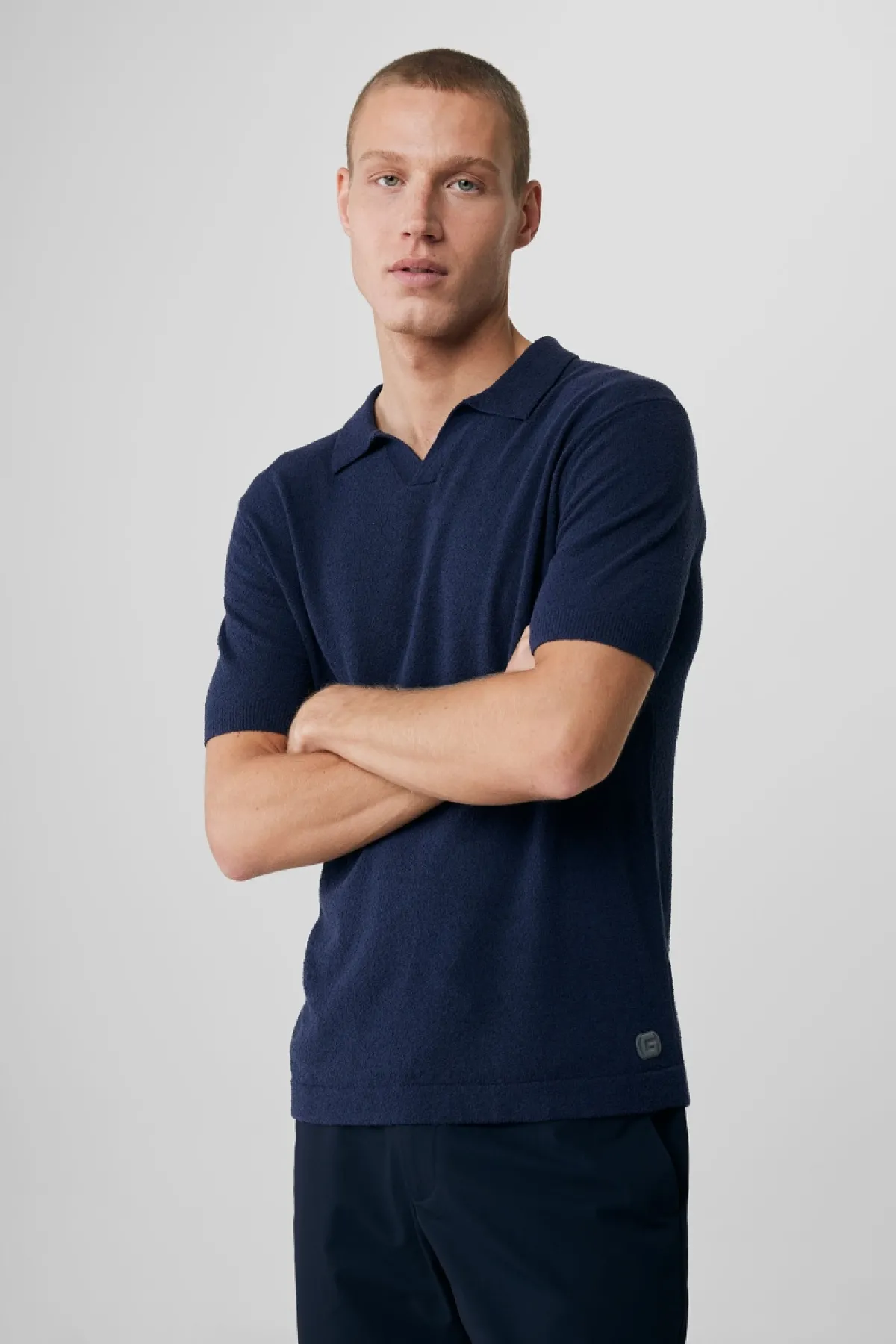 No button polo blauw